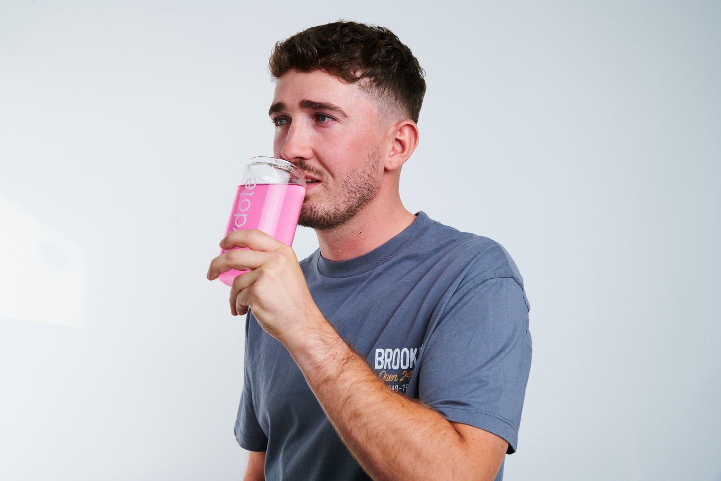 Man dropping electrolyte hydration tablet into drink